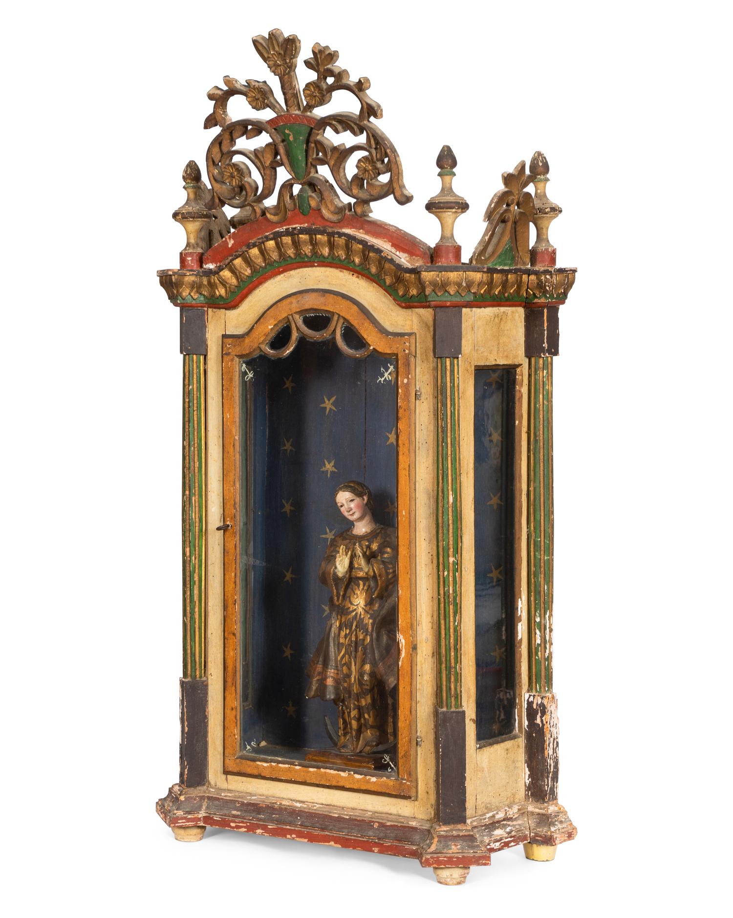 An Italian Polychrome Decorated Reliquary Cabinet with Carved Virgin of Guadalupe Figure