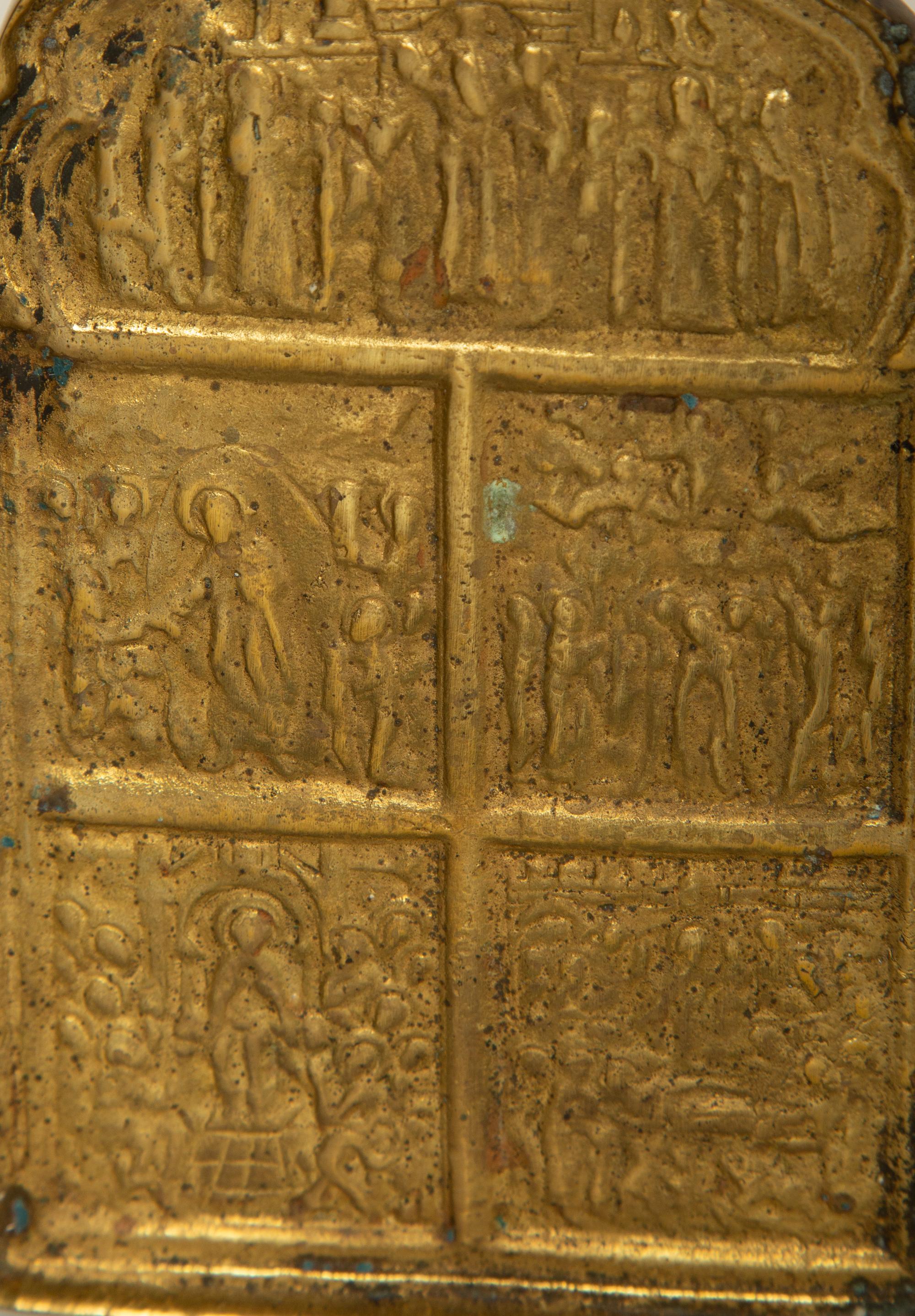 A Painted Russian Icon of Christ Enthroned Surrounded by Saints and a Brass Four-Panel Travel Prayer Icon