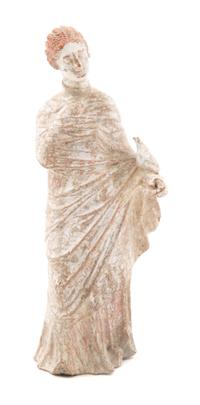 A Hellenistic Terra Cotta Tangara Figure Height 8 1/2 x width 3 1/2 x depth 2 1/2 inches. — ASIA MINOR, CIRCA THIRD CENTURY B.C.