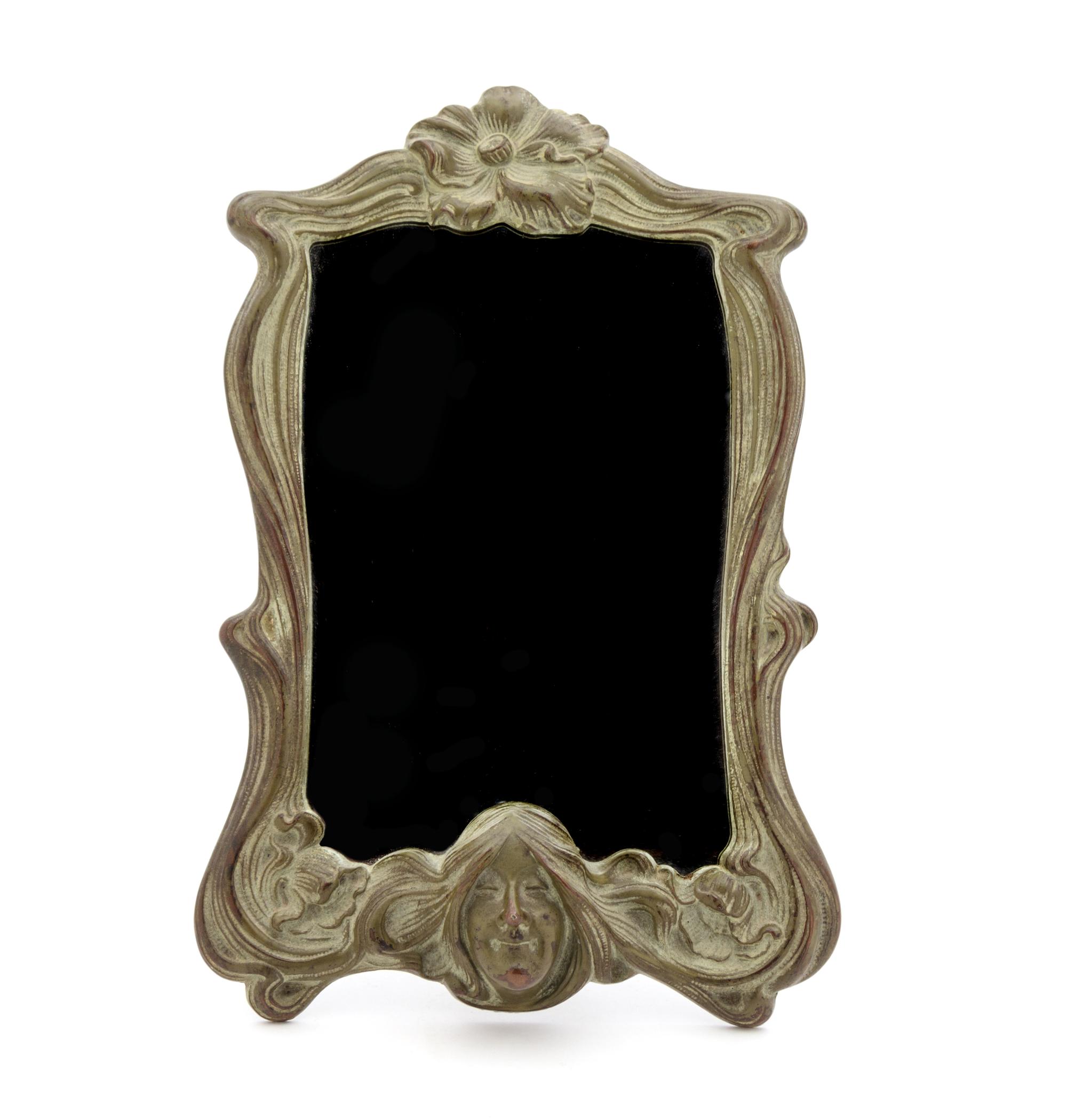 An Art Nouveau Bronze Dressing Mirror 12 1/2 x 7 3/4 inches.