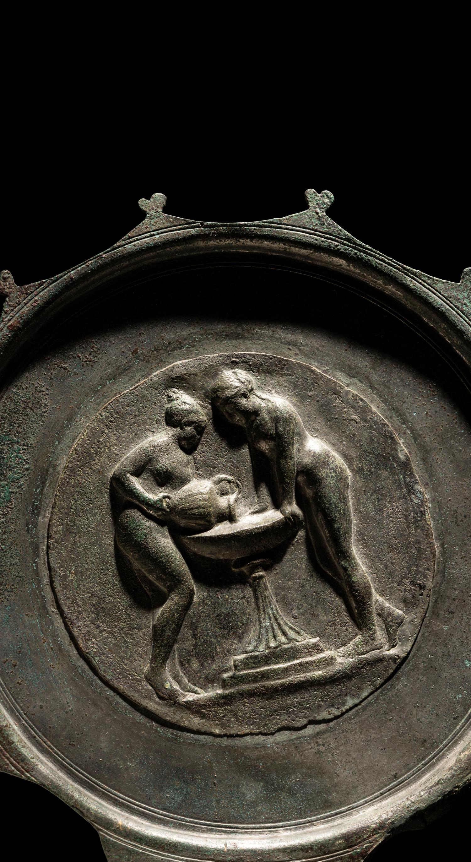 A Roman Bronze and Silver Mirror with Two Women