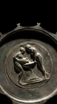 A Roman Bronze and Silver Mirror with Two Women