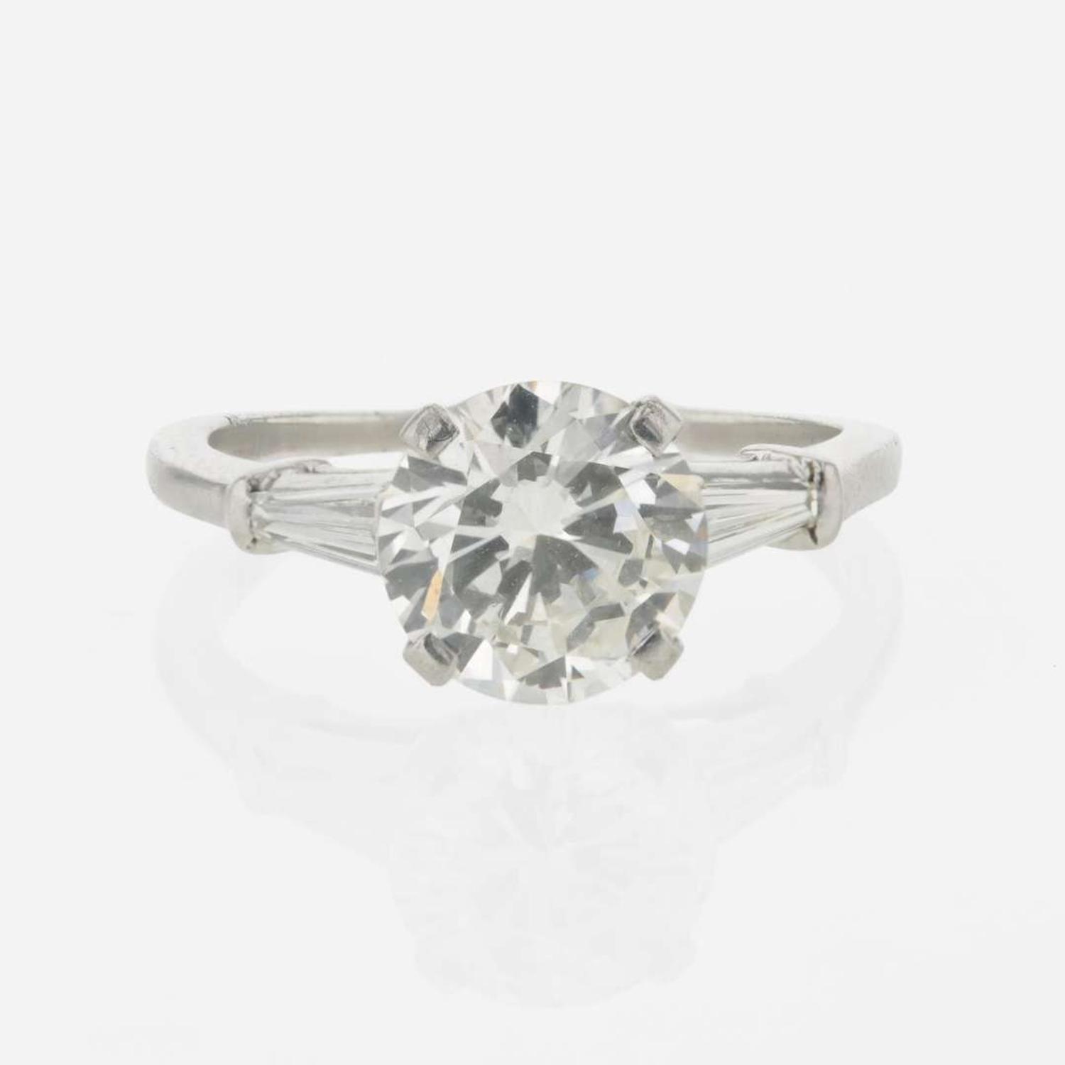 A diamond accented solitaire ring