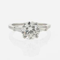 A diamond accented solitaire ring