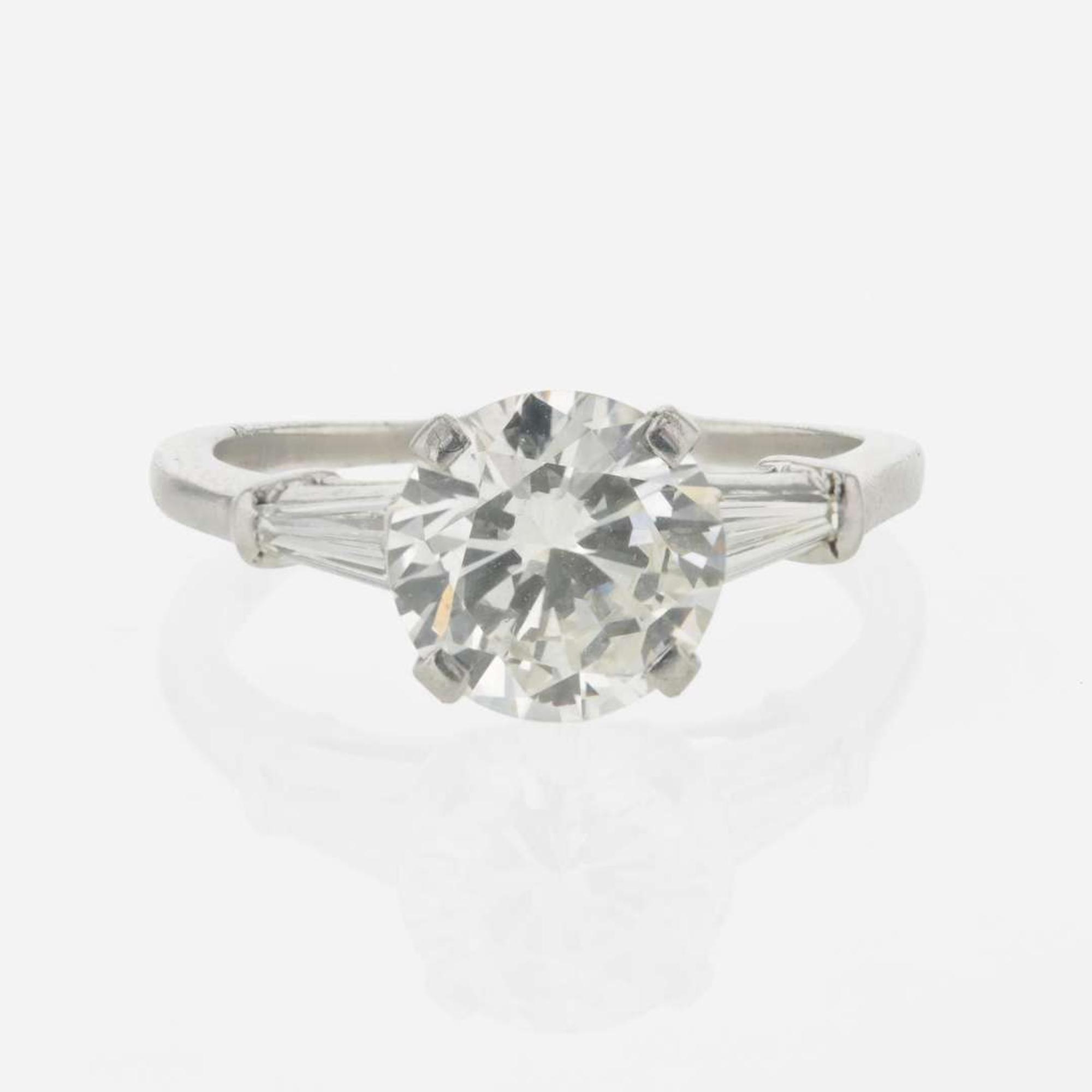 A diamond accented solitaire ring