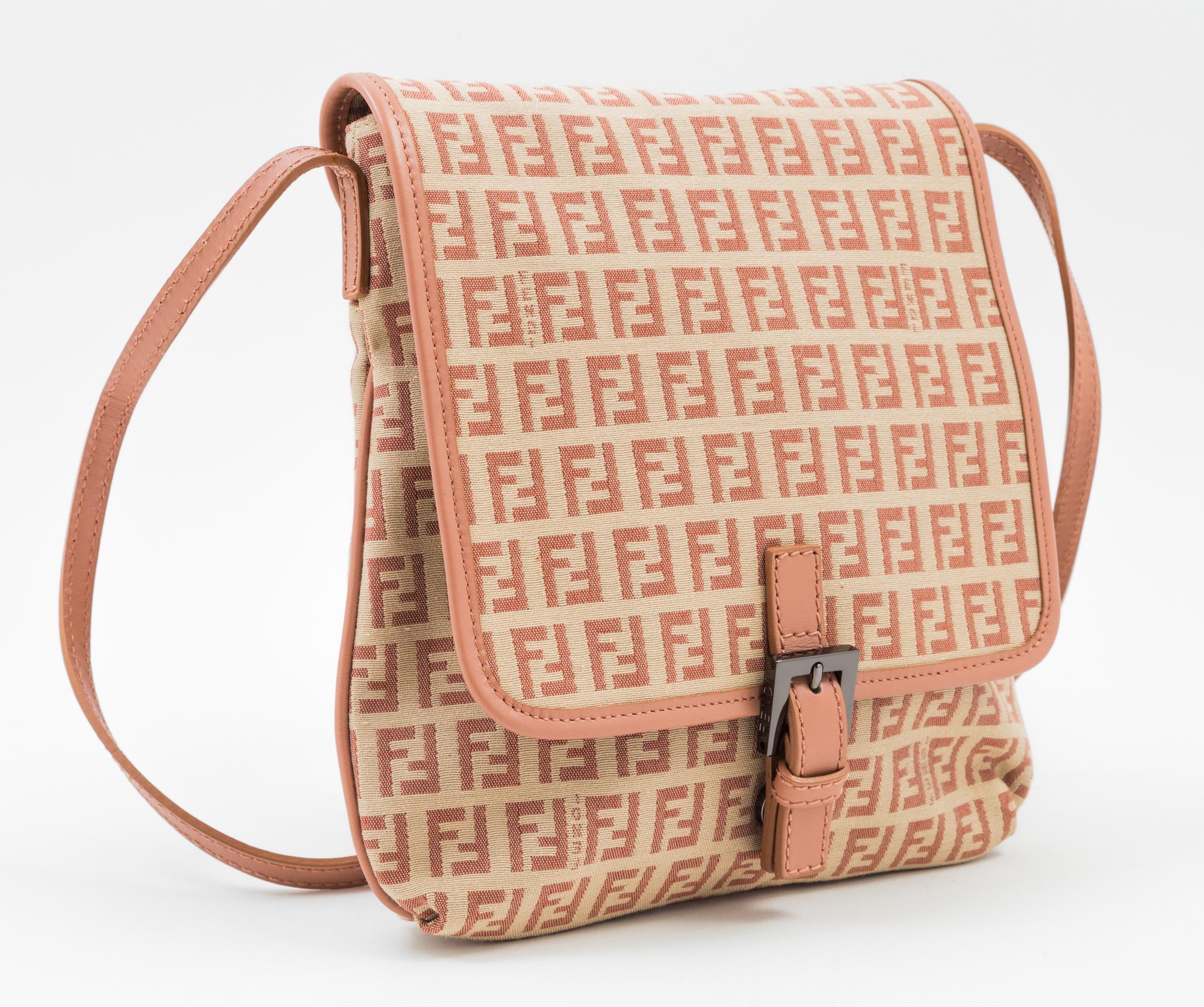 A Fendi Peach and Beige Monogram Canvas Cross Body Bag, 9" x 9" x. 5"; Strap drop: 20".