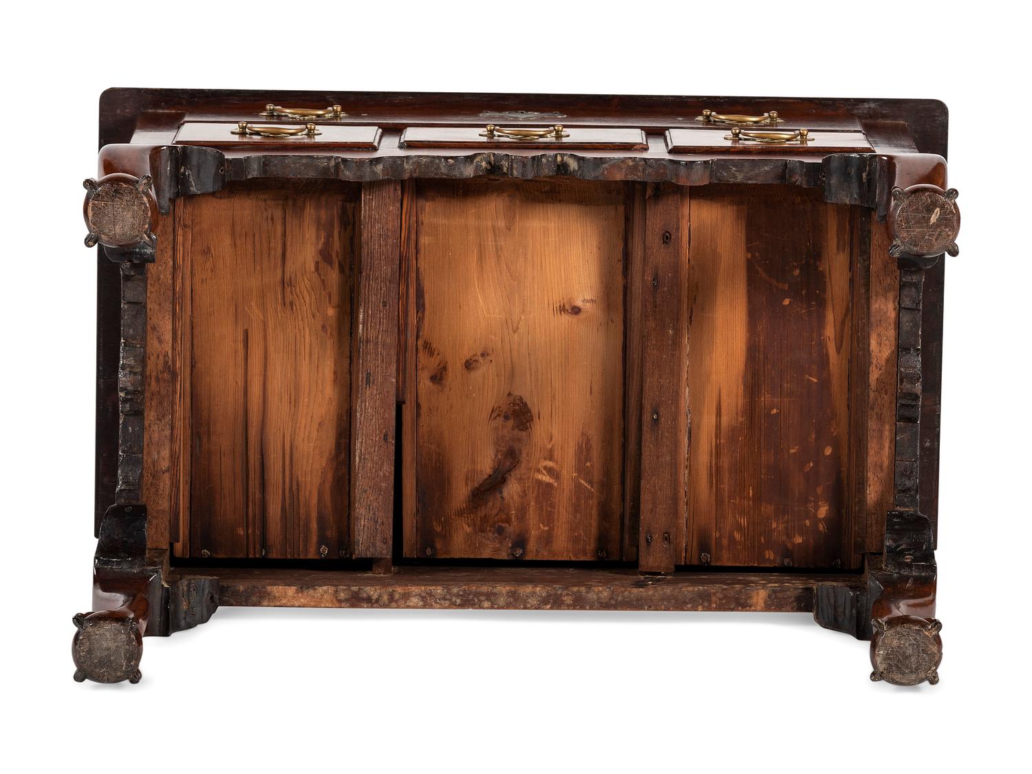 A Chippendale Carved and Figured Walnut Claw-and-Ball Foot Dressing Table