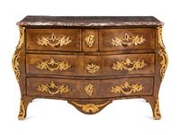 A Louis XV Gilt Bronze Mounted Tulipwood Commode