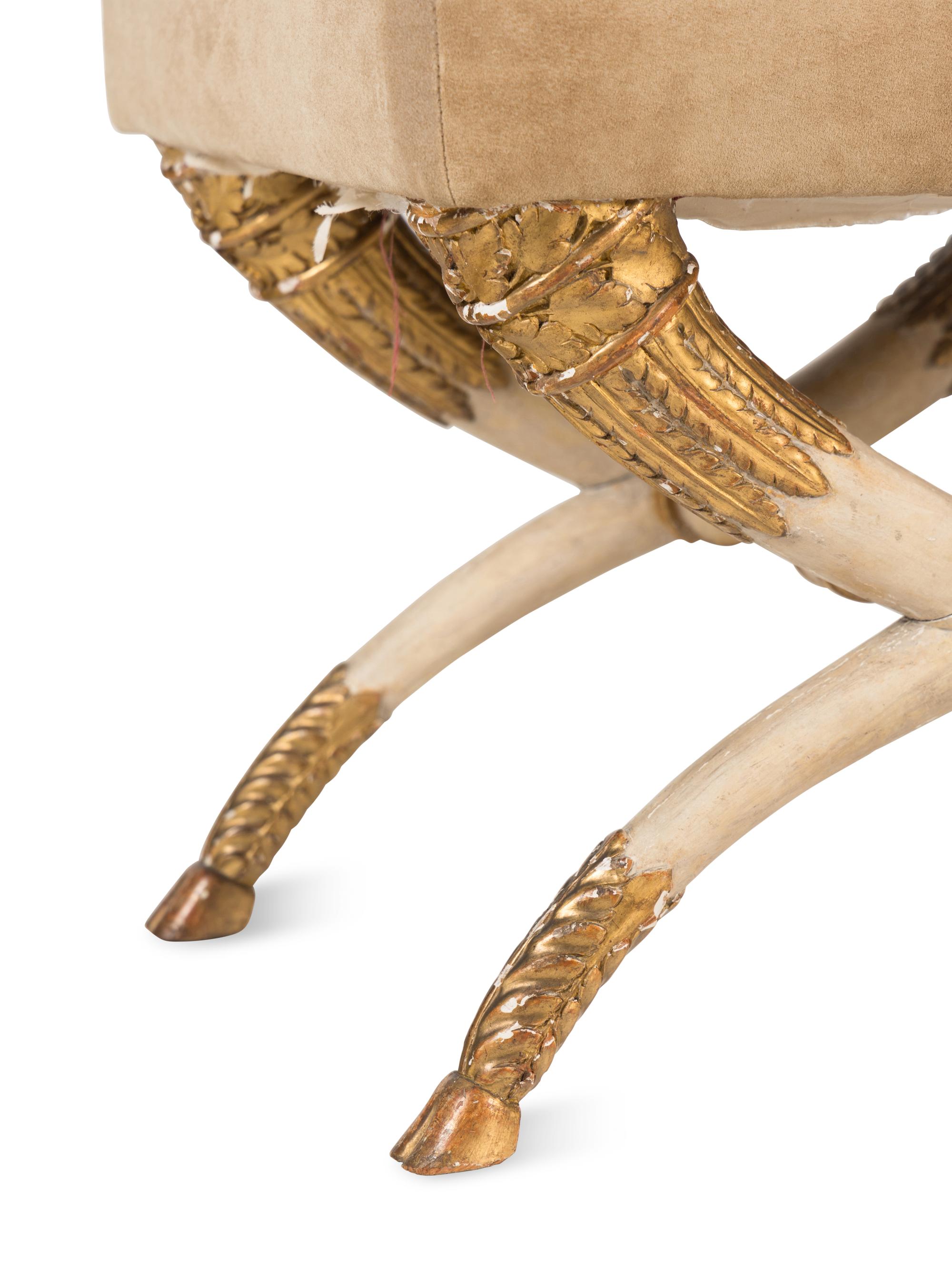 A Pair of Italian Cream-Painted and Parcel Gilt Curule-Form Stools