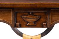 A Regency Style Inlaid Mahogany, Ebonized and Parcel-Gilt Side Table