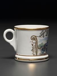 A Porcelain Shaving Mug Depicting an Open Touring Car