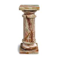 A Carved Onyx Pedestal