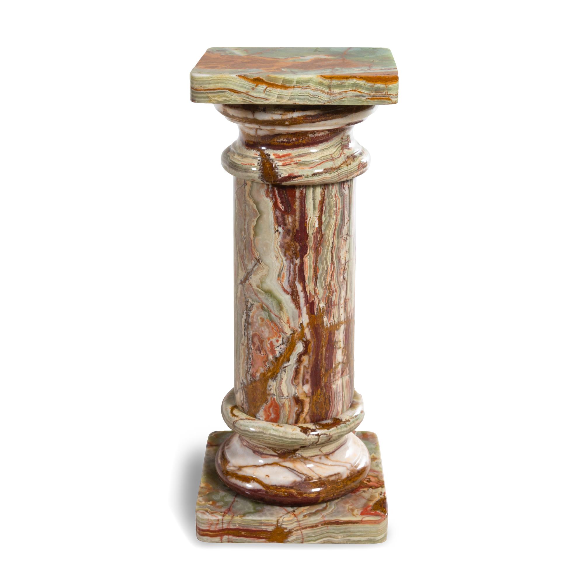 A Carved Onyx Pedestal