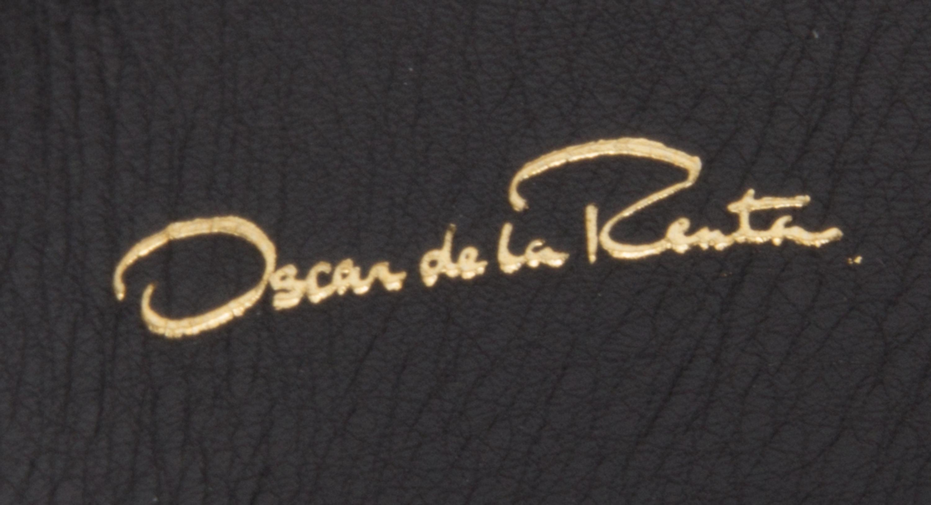 An Oscar de la Renta Black Leather Belt, 34".