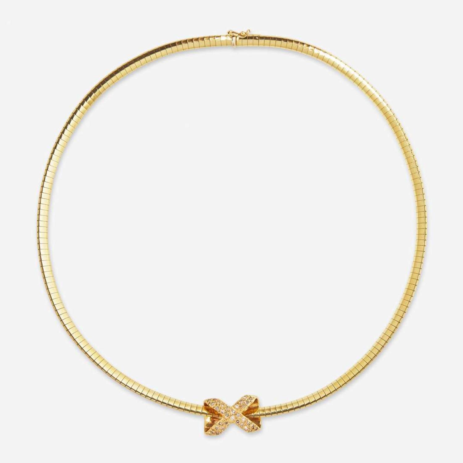 A 14K Yellow Gold Omega Chain and Slider Charms