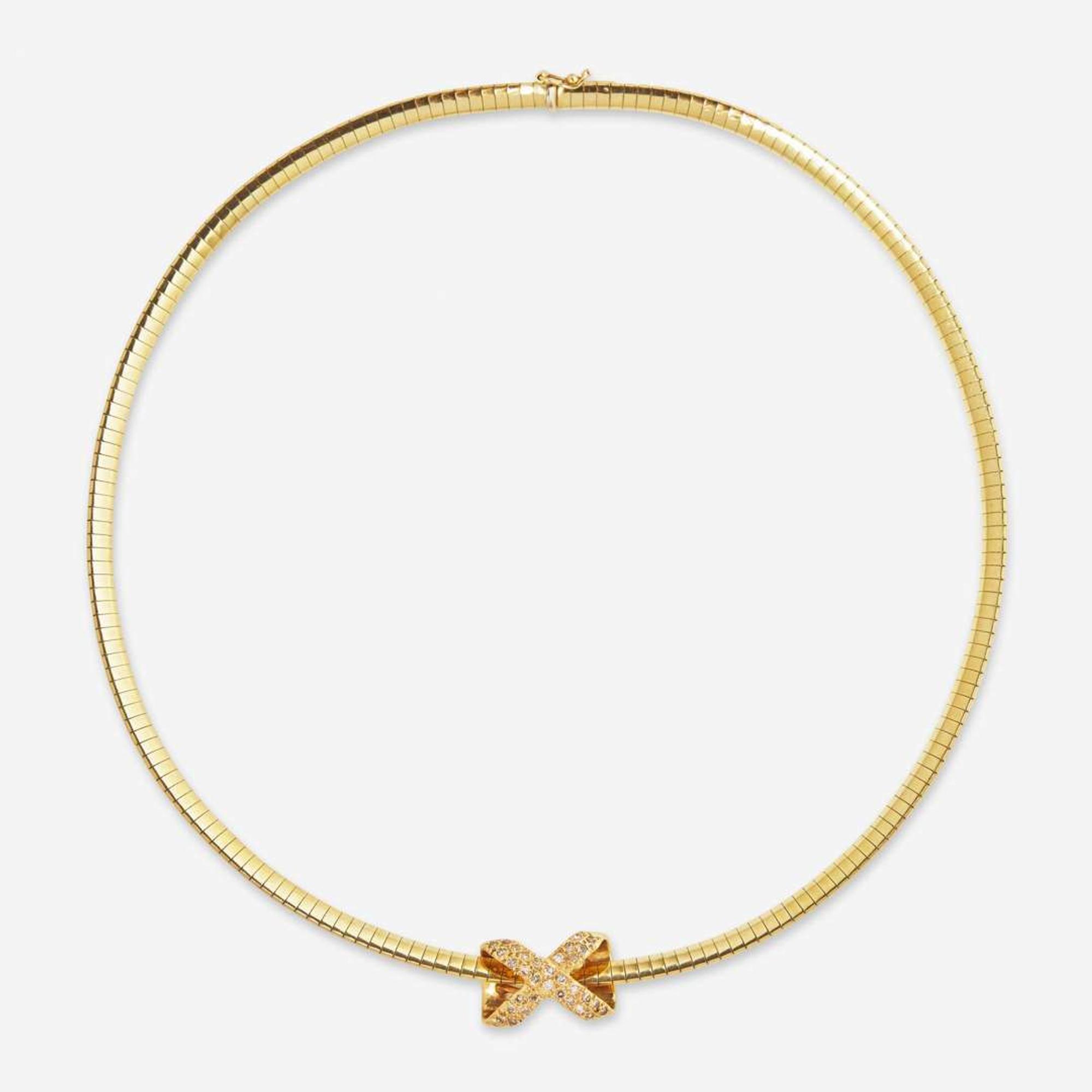 A 14K Yellow Gold Omega Chain and Slider Charms
