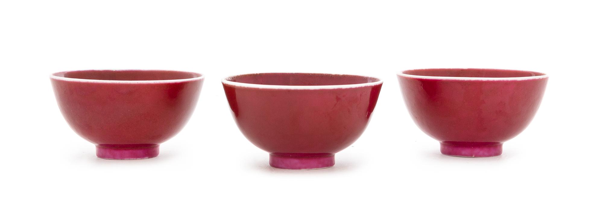 Three Chinese Sang-de-Boeuf Porcelain Tea Bowls Diameter of each 2 3/4 inches. — 19TH CENTURY