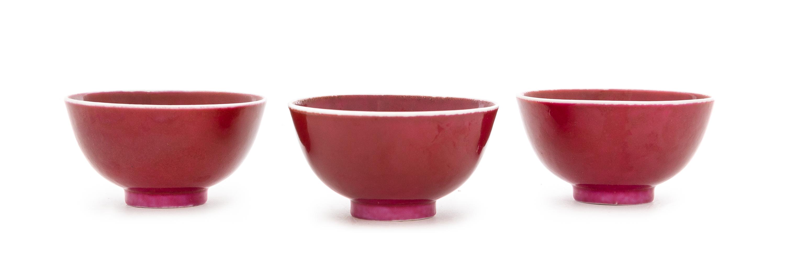 Three Chinese Sang-de-Boeuf Porcelain Tea Bowls Diameter of each 2 3/4 inches. — 19TH CENTURY