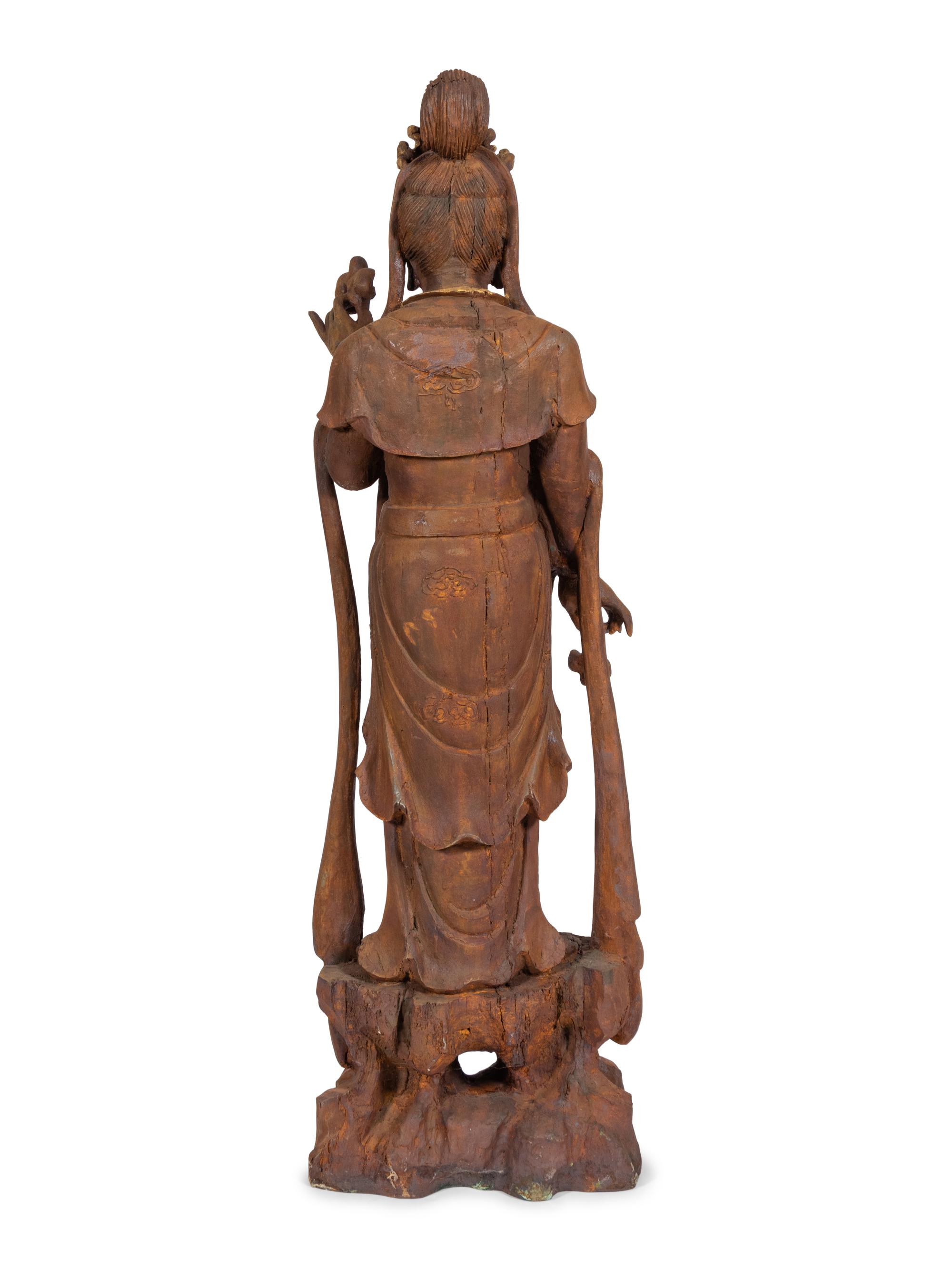 A Carved and Gilt Guanyin Statue