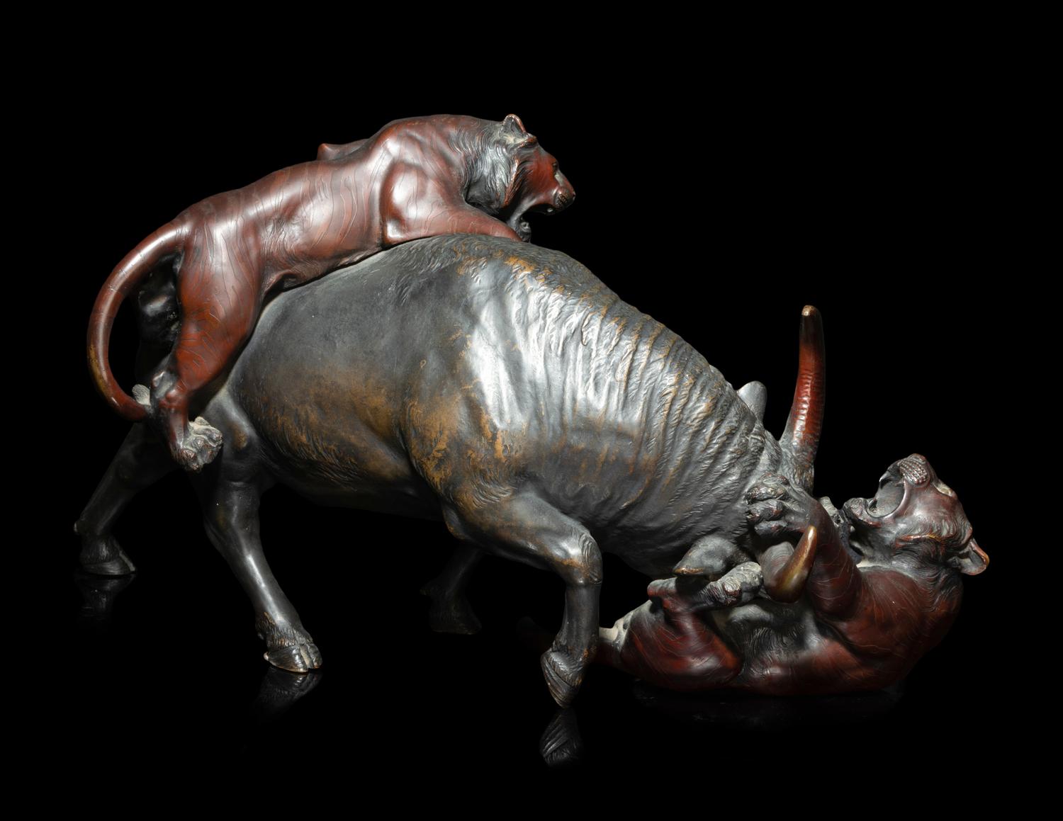 A Japanese Bronze Okimono of Two Tigers and A Bull