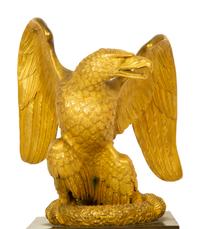 A Gilt Bronze Eagle Sculpture on an Empire Style Gilt and Patinated Bronze Base