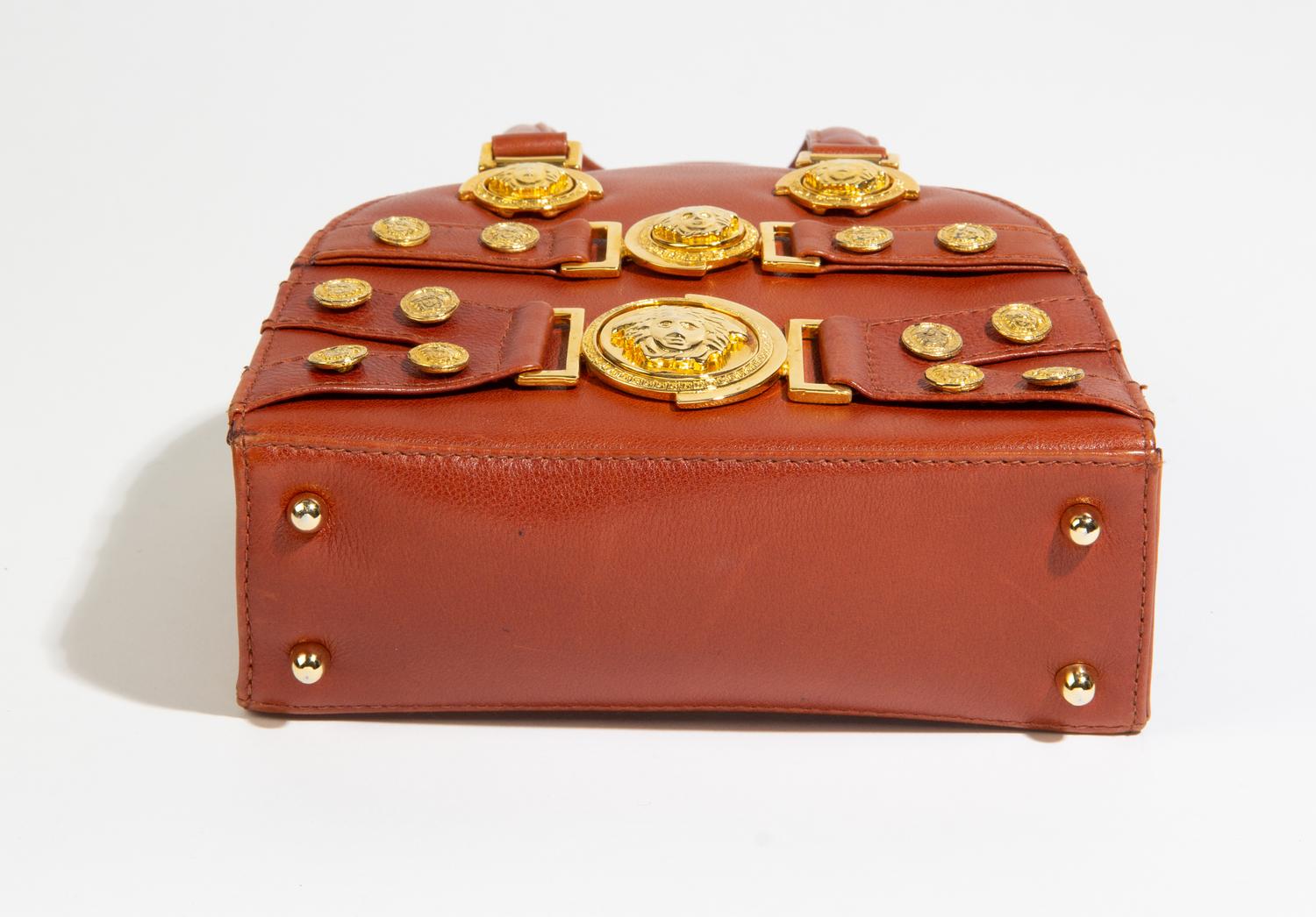 A Gianni Versace Brown Leather Mini Medusa Handbag, 7" x 6.5" x 2.5".