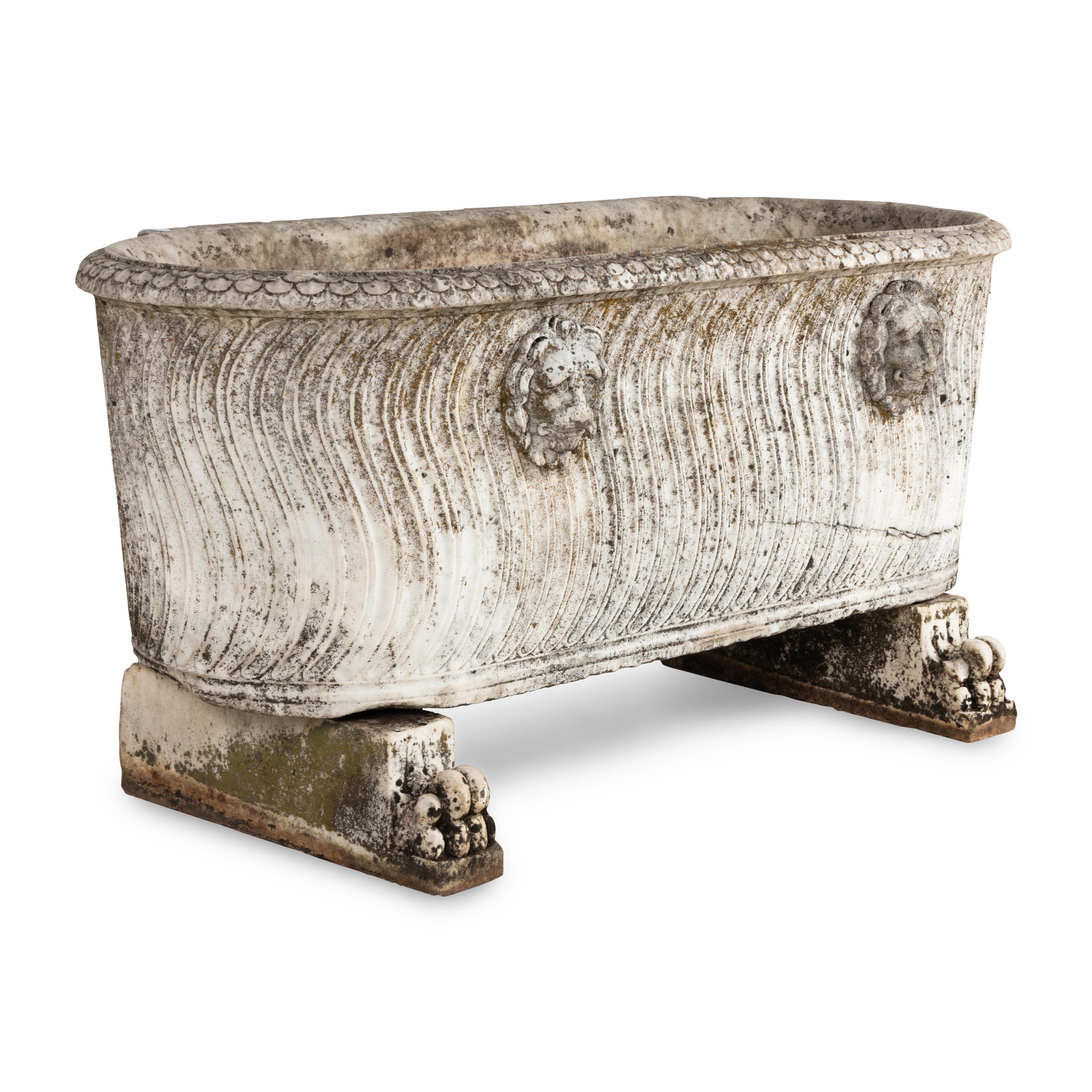 A Neoclassical Carved Marble Sarcophagus