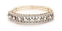 A Bicolor Gold, Cultured Pearl and Diamond Bangle Bracelet, 20.80 dwts.