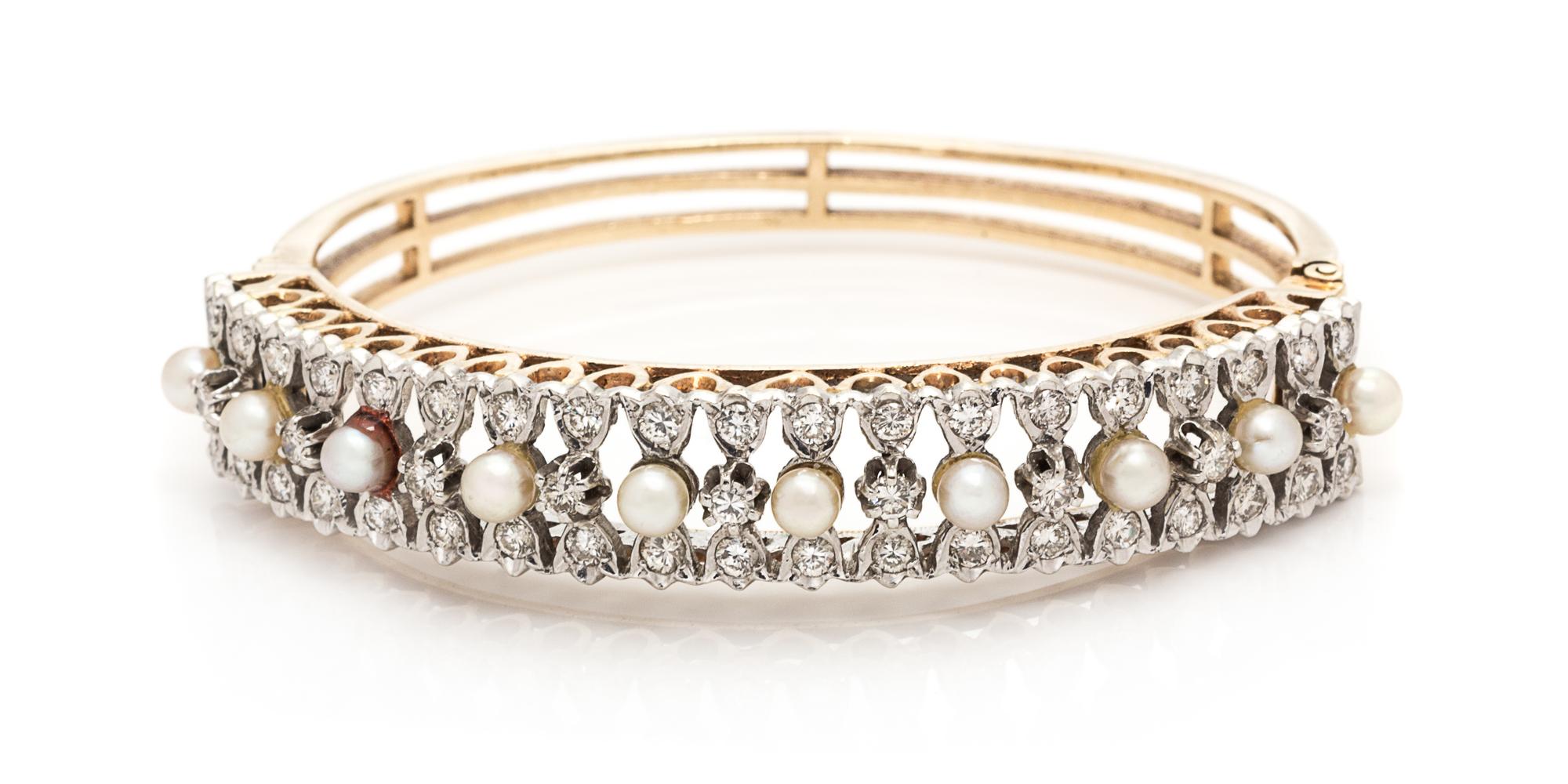 A Bicolor Gold, Cultured Pearl and Diamond Bangle Bracelet, 20.80 dwts.