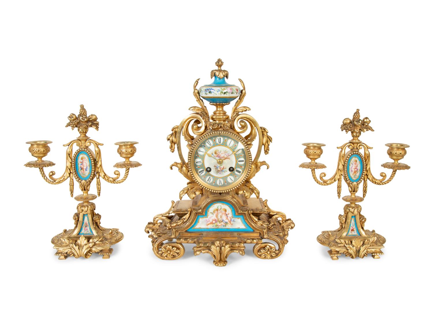 A French Gilt Bronze and Sèvres Porcelain Clock Garniture