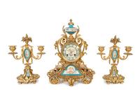 A French Gilt Bronze and Sèvres Porcelain Clock Garniture