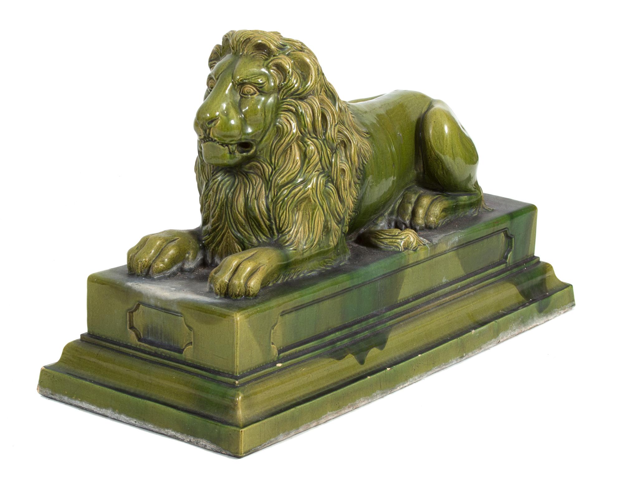 A Green Glazed Ceramic Recumbent Lion Height 23 x width 16 x depth 36 inches. — 20TH CENTURY