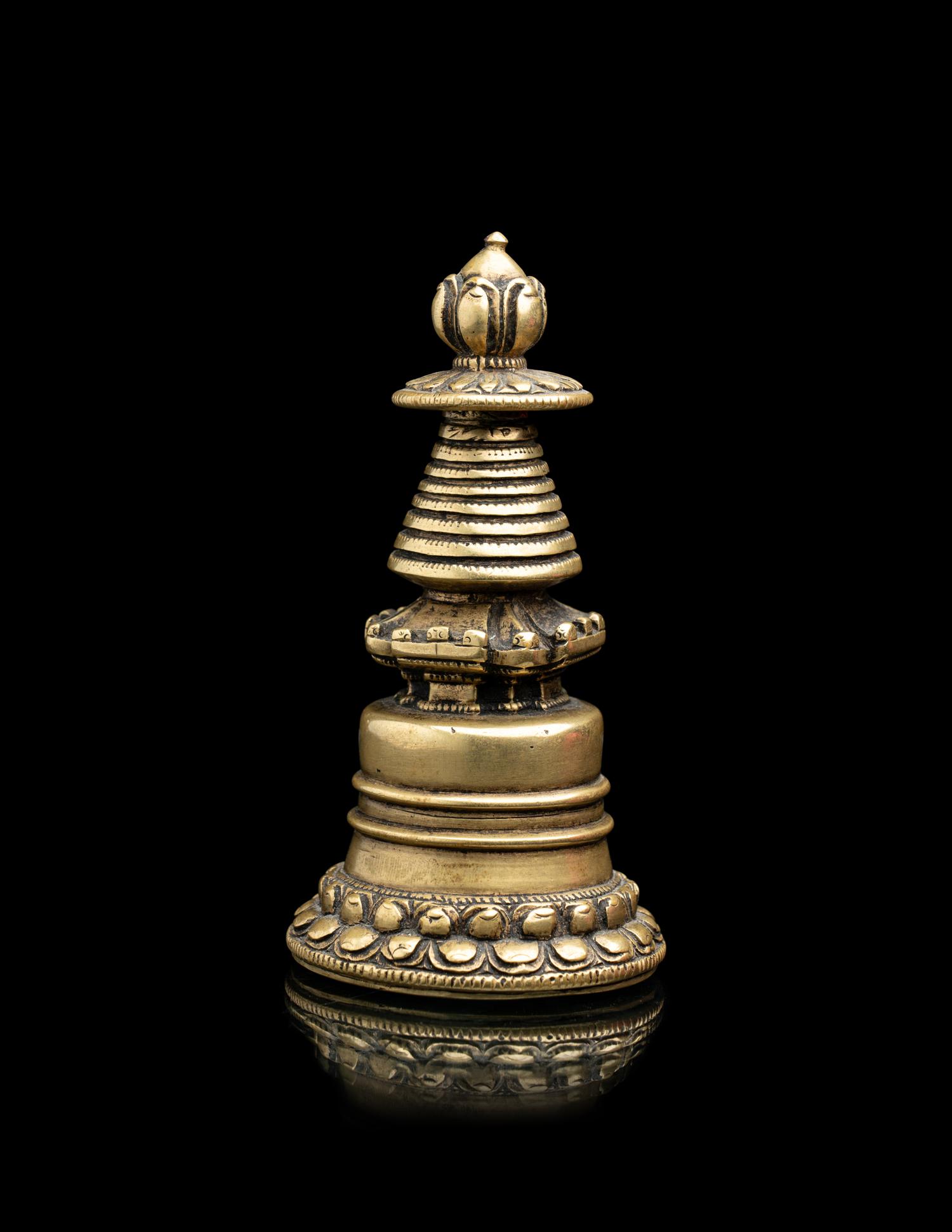 A Small Tibetan Bronze Pala-Style Model of a Stupa