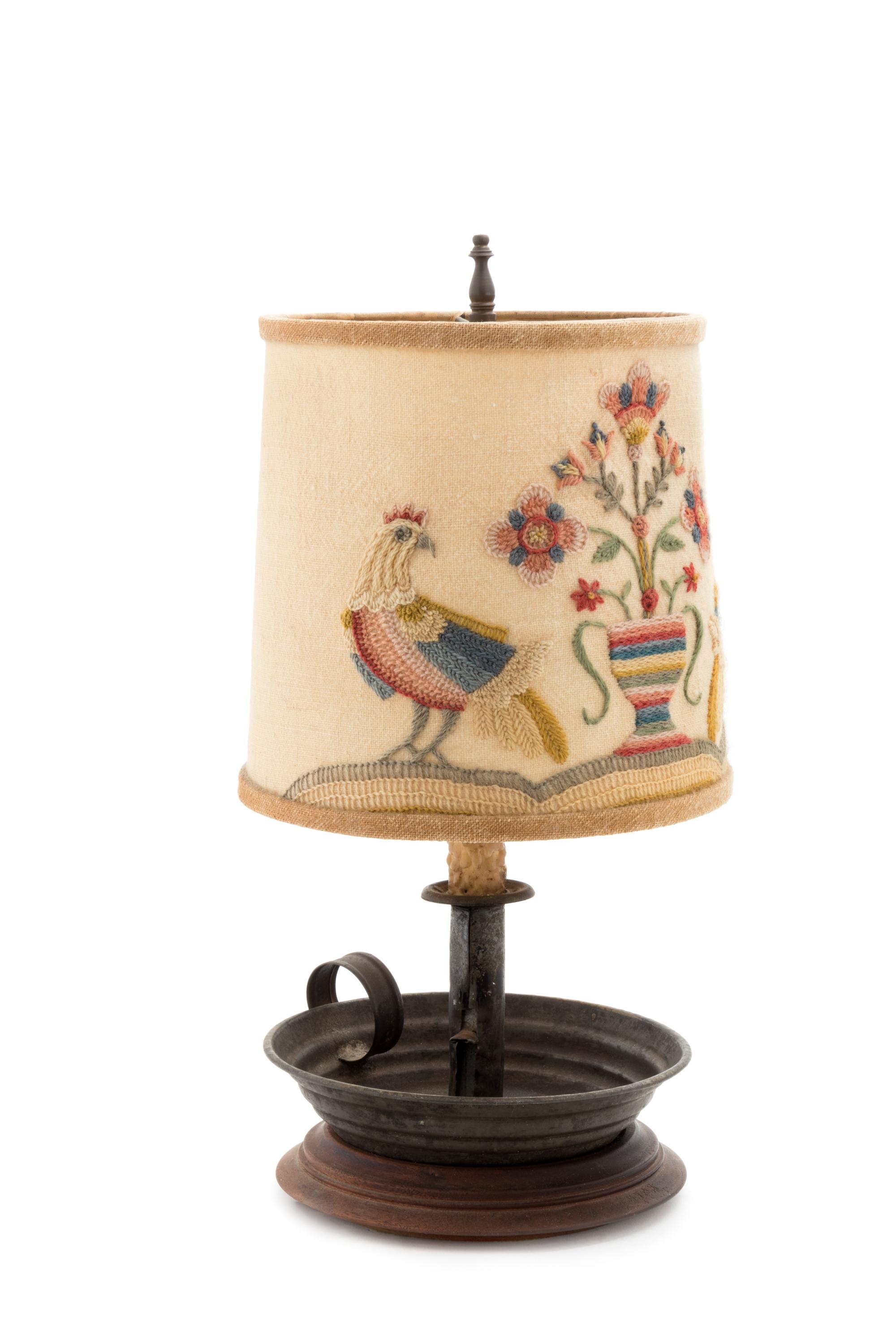 A Primitive Metal Candlestick with a Later Crewel Work Shade