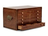 A Regency Brass Mounted and Inlaid Mahogany Spool Cabinet