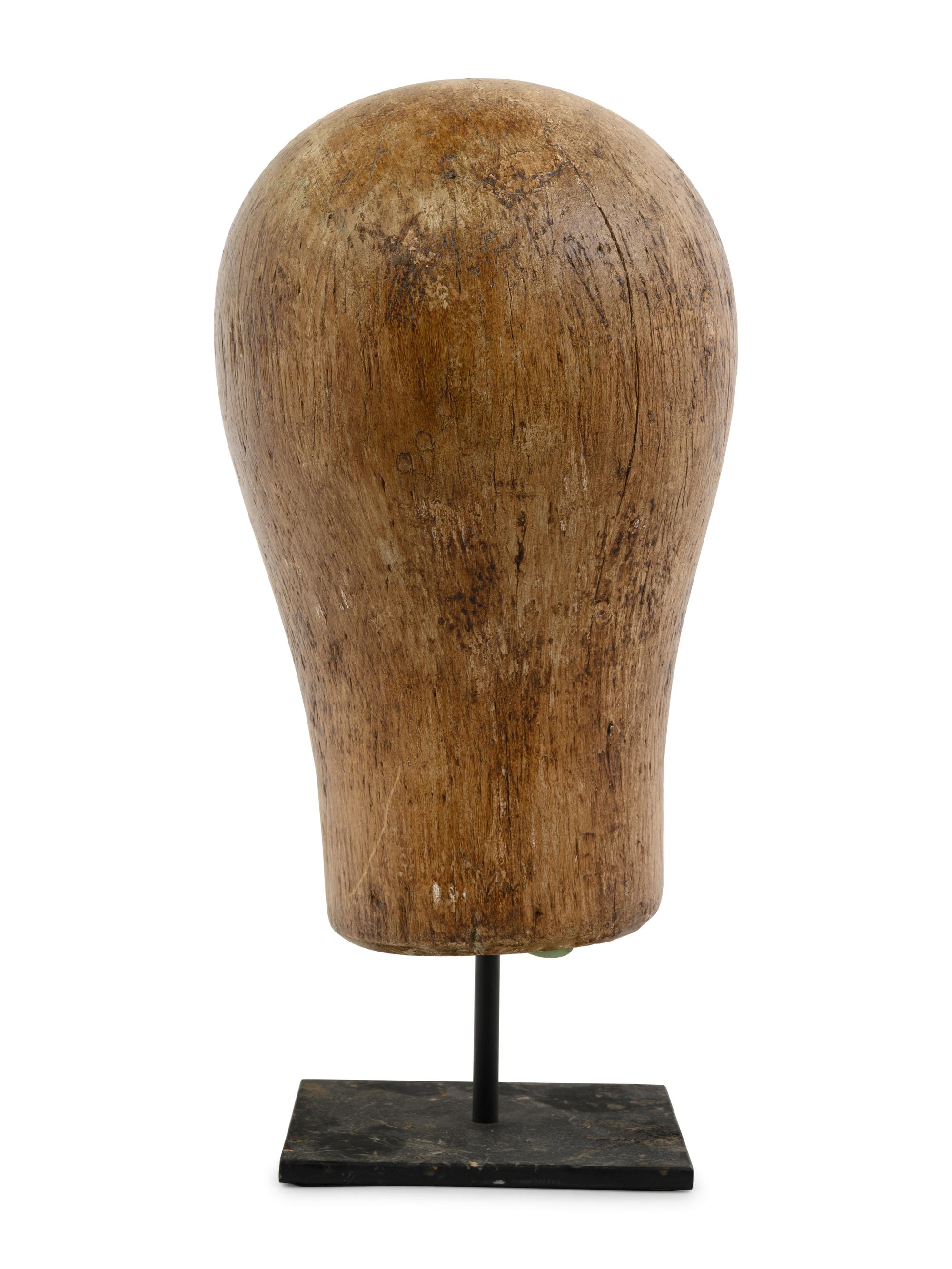 A Carved Wood Mannequin Head