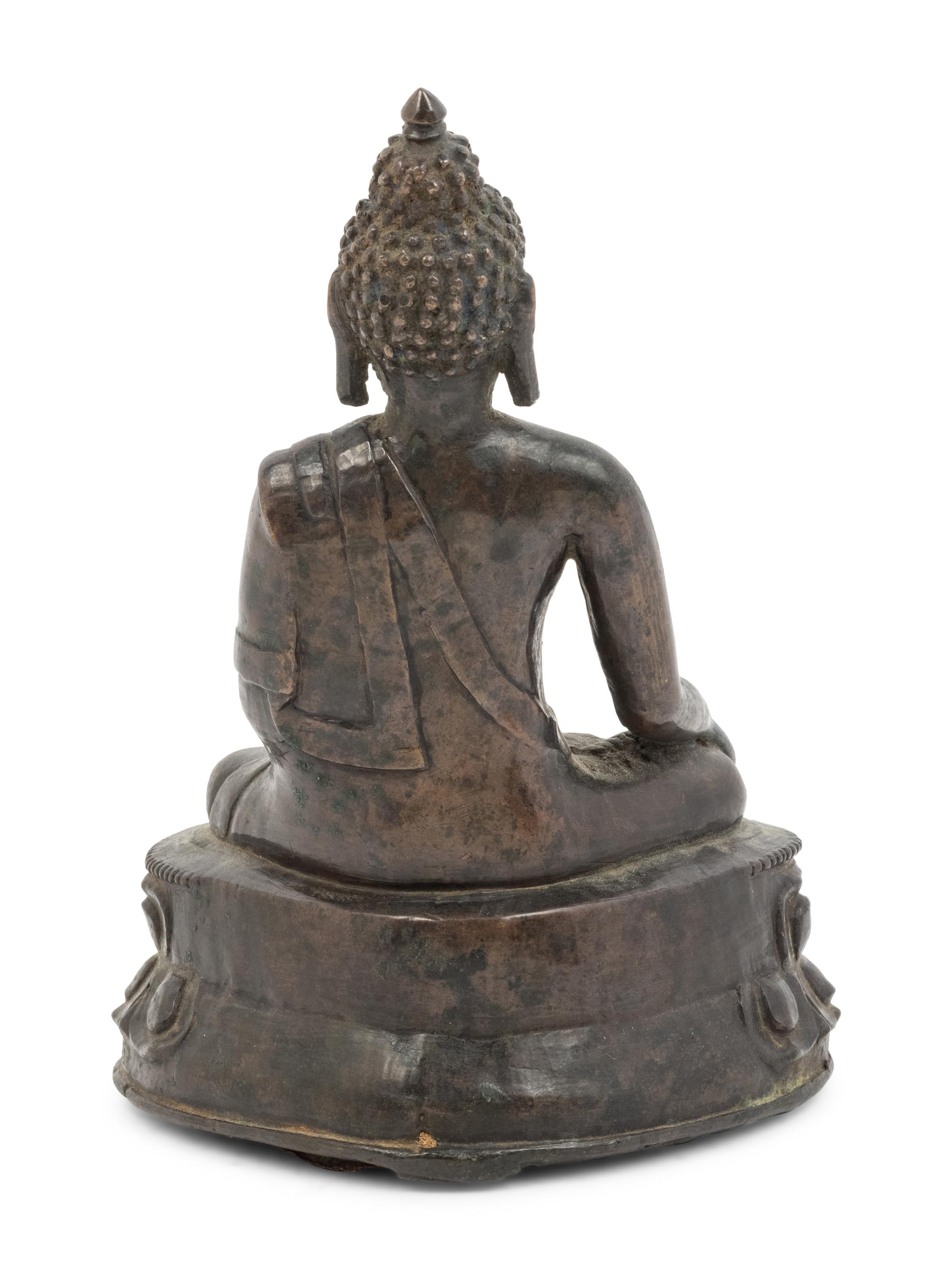 A Tibetan Bronze Figure of Seated Buddha Akshobhya