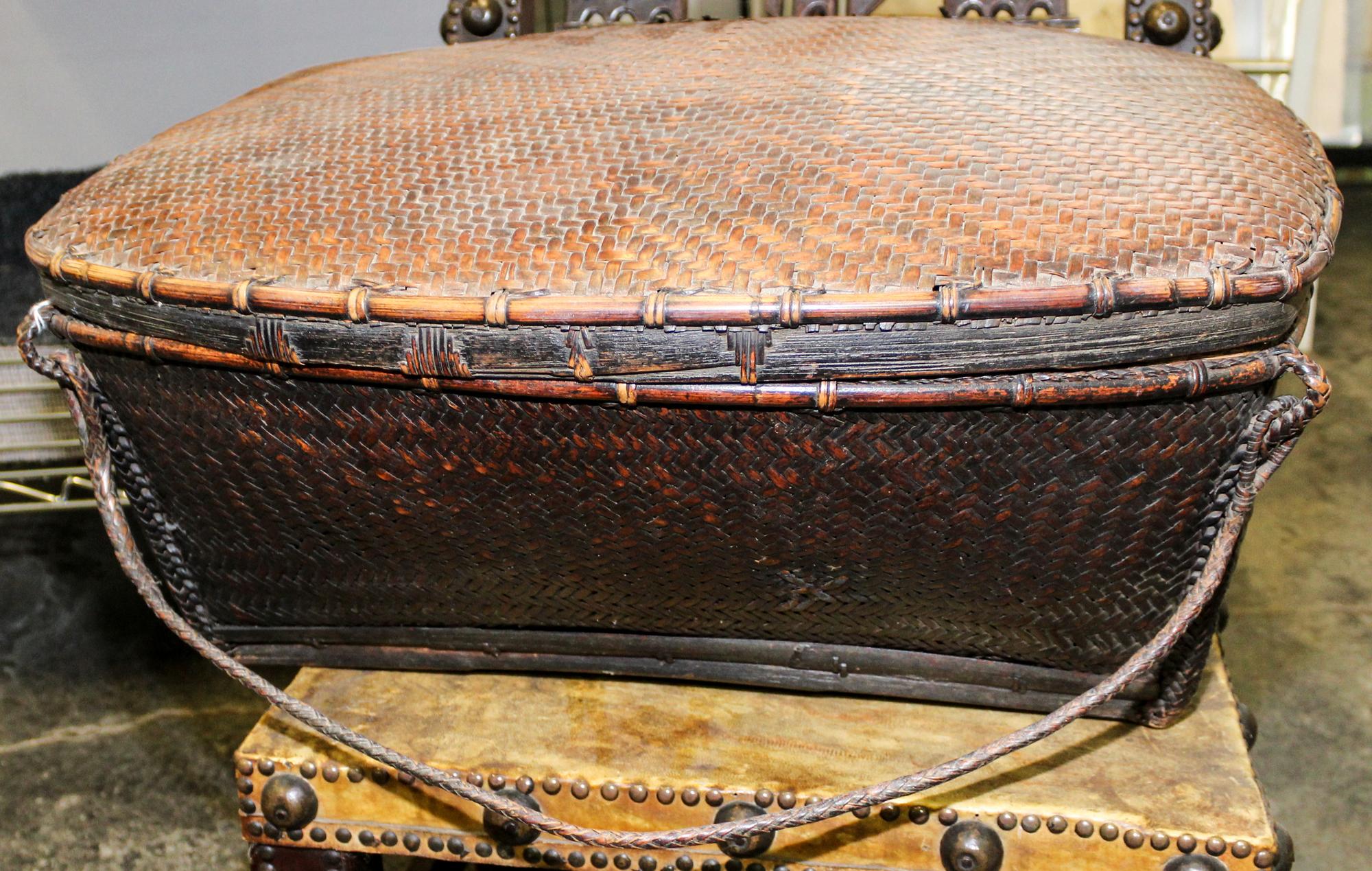 A Tribal Wood Basket Height 11 x width 23 1/4 x depth 18 inches.