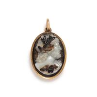 A Neoclassical Gold and Sardonyx Cameo Brooch with the God Jupiter