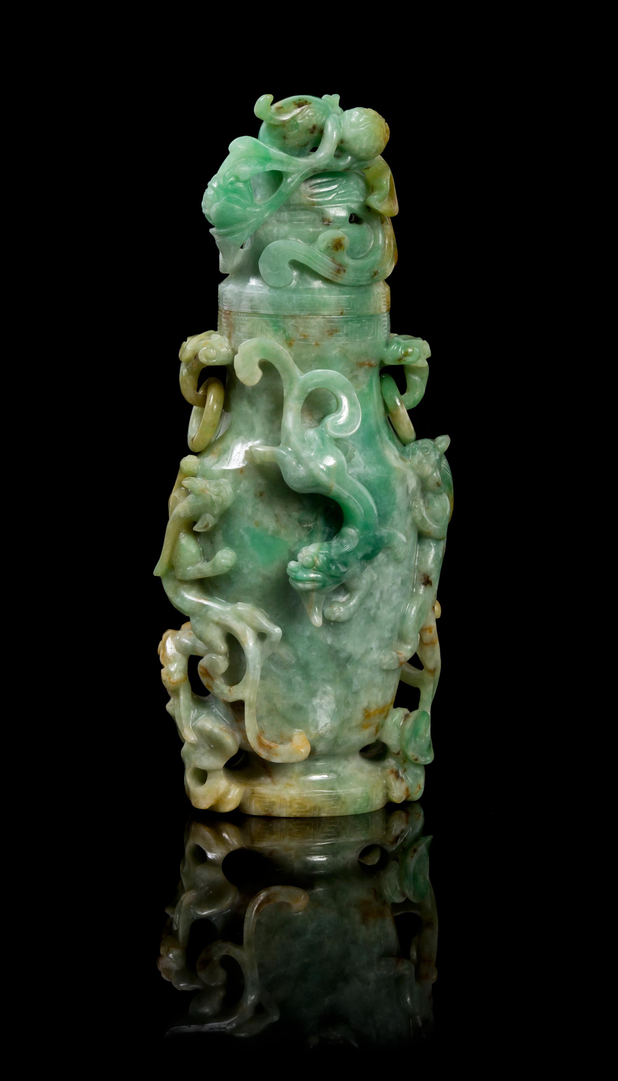A Chinese Jadeite Covered Vase LATE 19TH/EARLY 20TH CENTURY Height 7 1/2 x width 3 inches. — LATE 19TH/EARLY 20TH CENTURY
