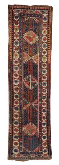 A Northwest Persian Wool Runner, 13 feet 9 inches x 4 feet 2 inches.