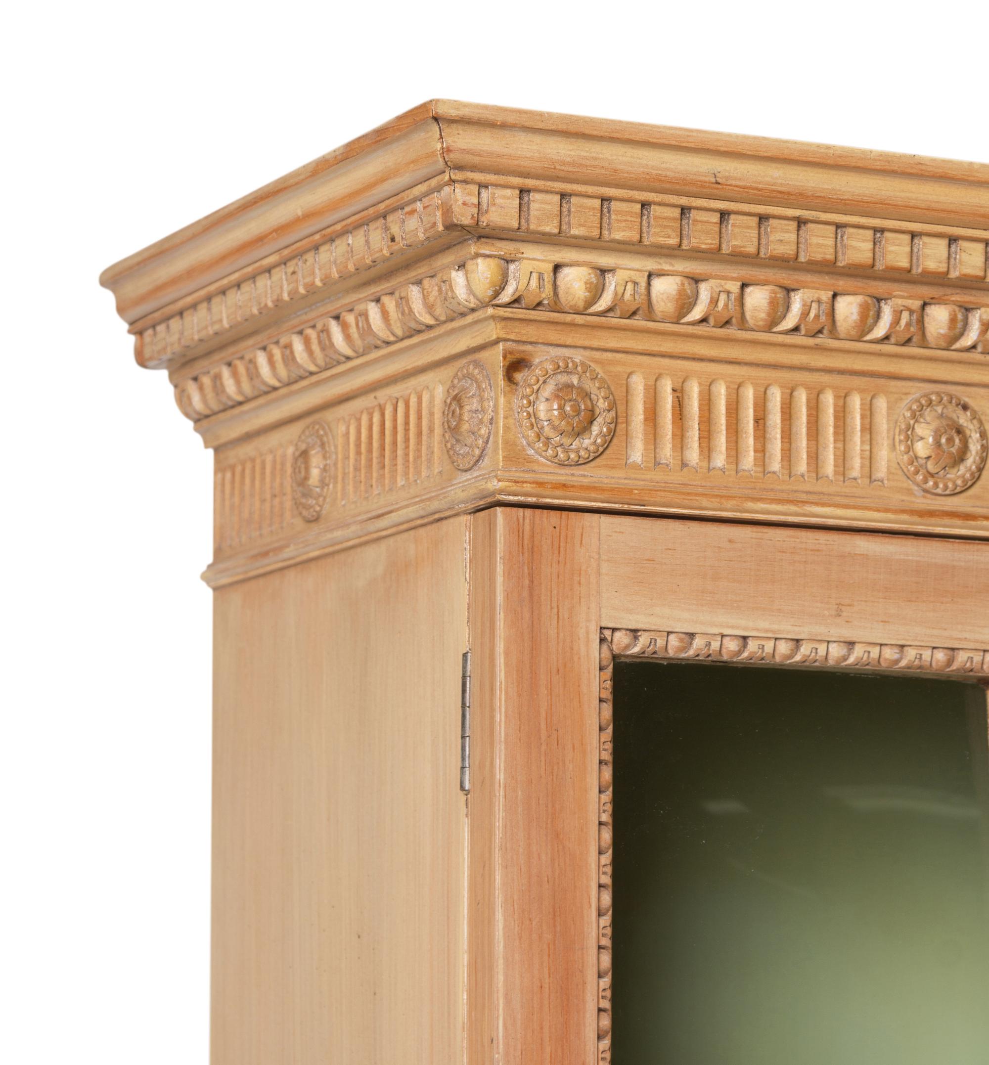 A George III Style Carved Pine Breakfront Bookcase