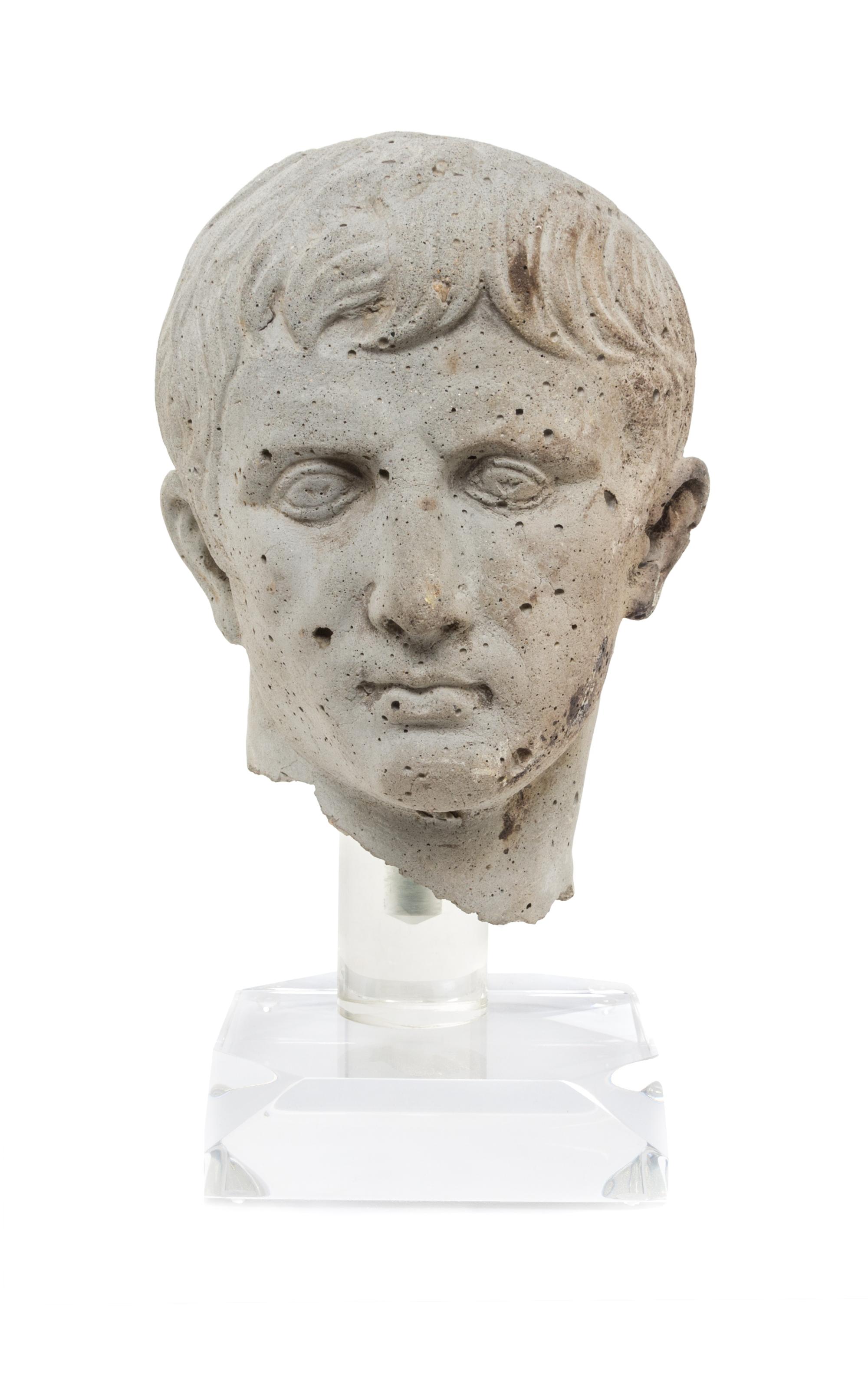 An Italian Cast Stone Bust Height 13 inches. — AFTER THE ANTIQUE, 20TH CENTURY