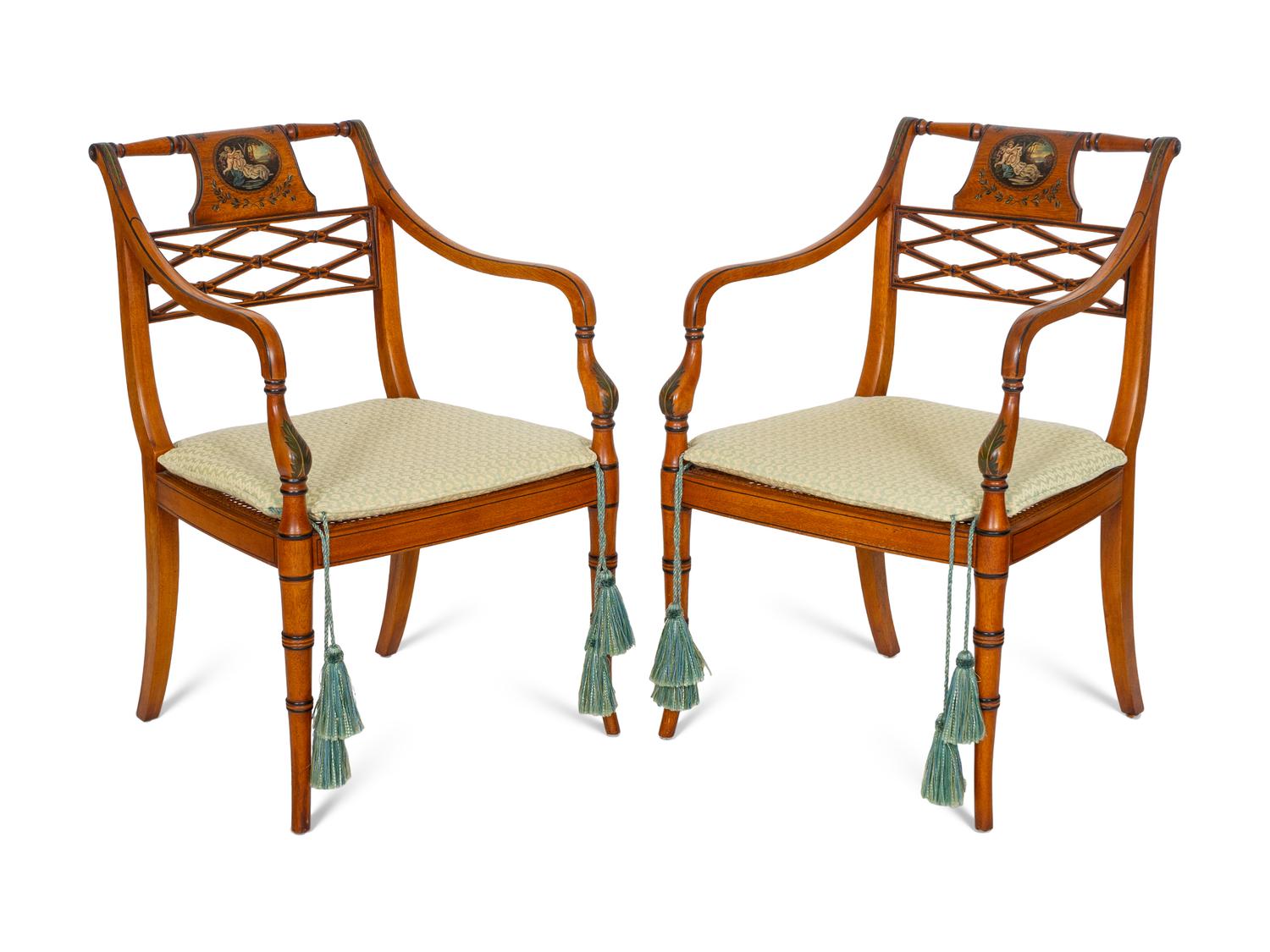 A Pair of Regency Style Paint Decorated and Parcel Ebonized Armchairs