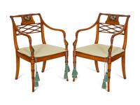 A Pair of Regency Style Paint Decorated and Parcel Ebonized Armchairs