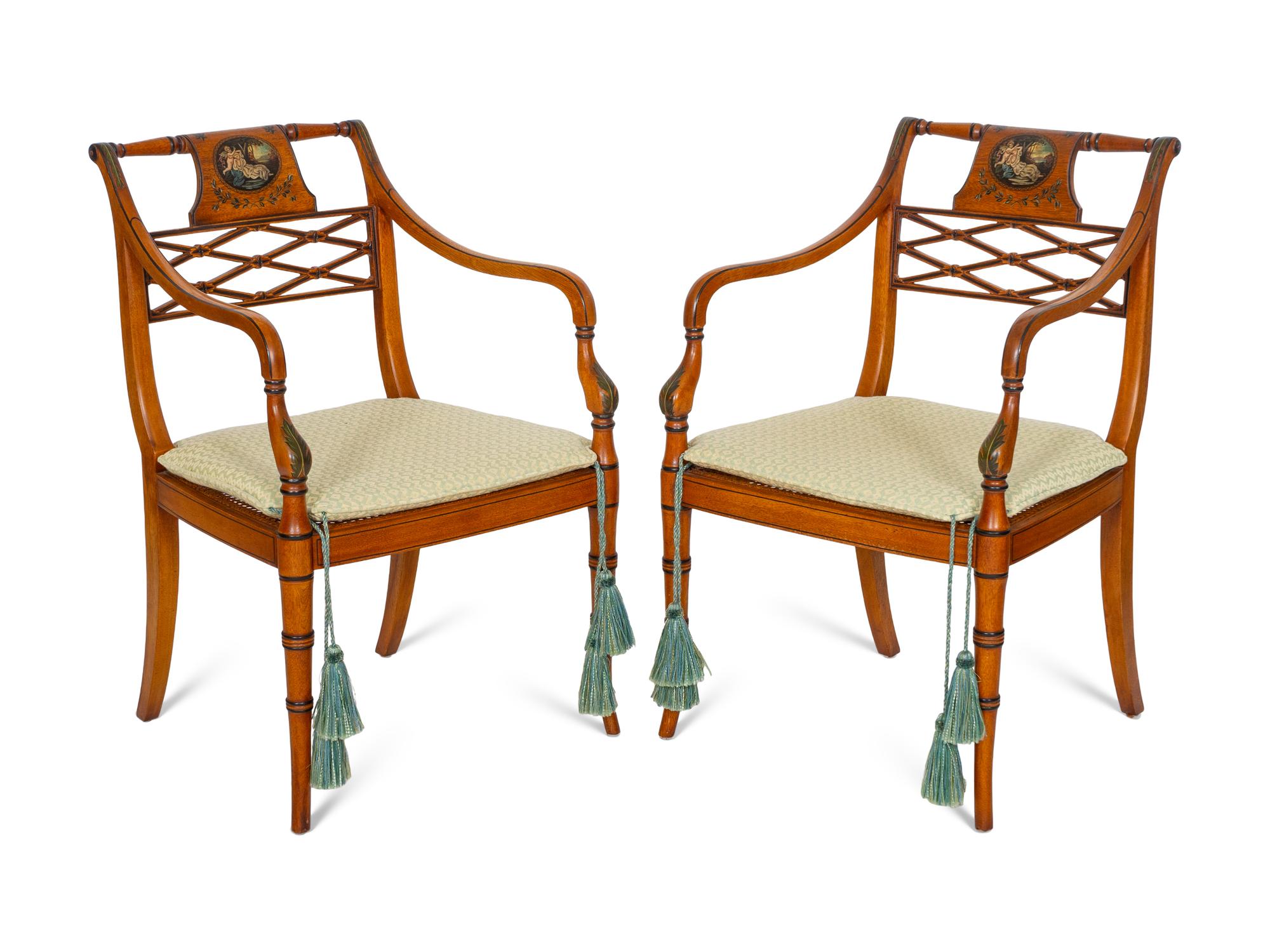 A Pair of Regency Style Paint Decorated and Parcel Ebonized Armchairs