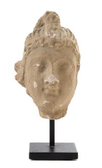 A Gandharan Stucco Head of a Male Height 3 3/4 inches.