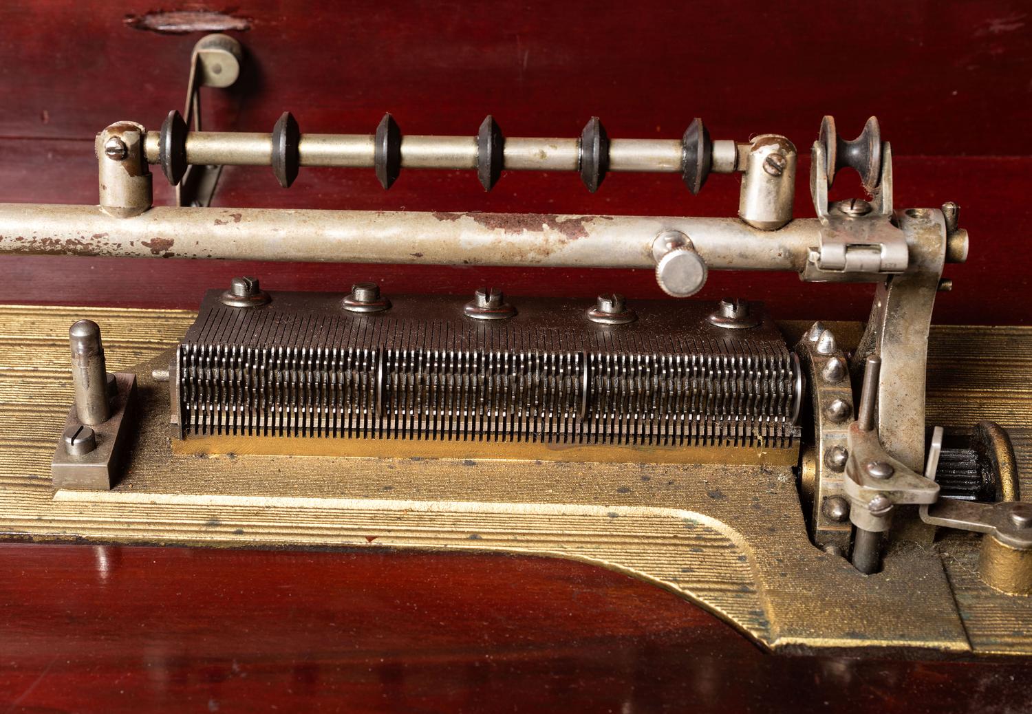 A Mira Mahogany-Cased Disc Music Box and Cabinet
