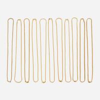 A collection of eleven fourteen karat gold necklaces