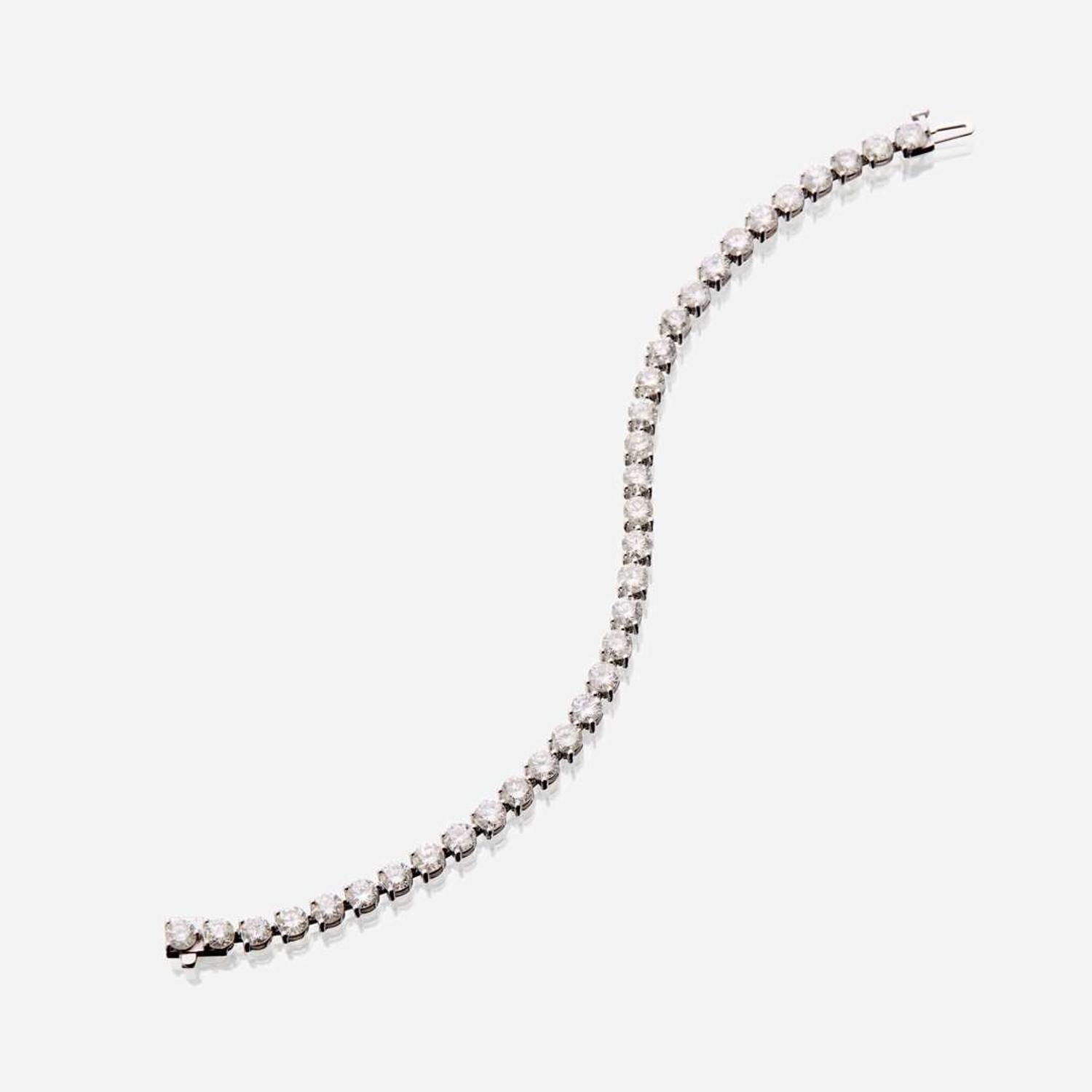 A diamond and eighteen karat white gold bracelet